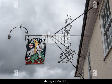 The George, Hambledon, pub sign remains even though the pub has now been turned apartments. Stock Photo