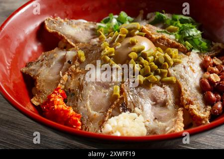 A closeup view of a bowl of crispy pork rice noodle. Stock Photo