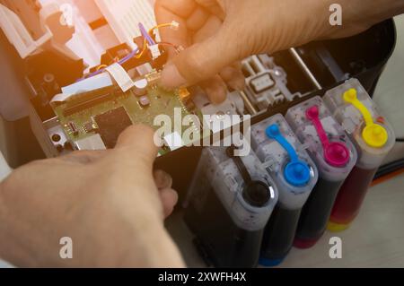 Top view of technician repairing printer Stock Photo
