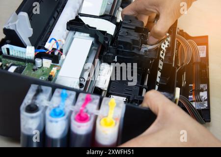 Top view of technician repairing printer Stock Photo