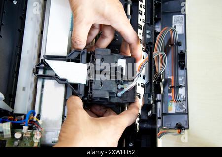 Top view of technician repairing printer Stock Photo