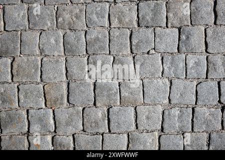 Cobblestone street background with grey square stones Stock Photo
