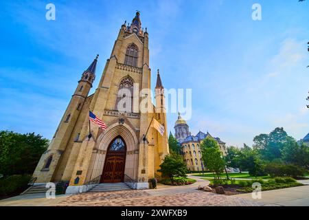 Gothic Revival Basilica and Golden Dome on Lush Campus Low-Angle View Stock Photo