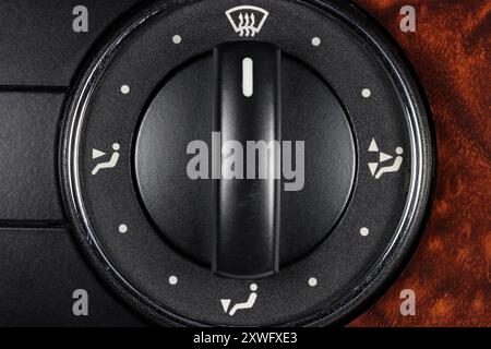 air flow direction switch inside a used car Stock Photo