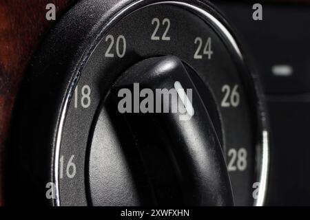 temperature control switch inside a used car at 20 degrees Celsius Stock Photo