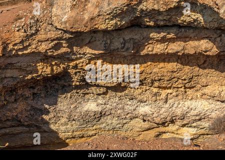 Layers of sediment in rocks seen on thecoastline between Marinha Beach and Vale Centeanes Beach, Algarve, Portugal, Europe. Stock Photo