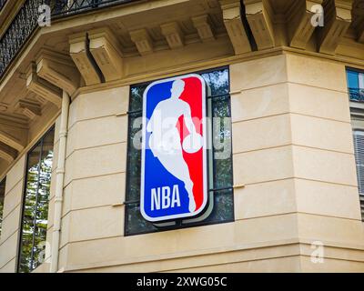 08 19 2024 - Paris, France. NBA store sign with league logo on an old building in Paris city where is located official fans apparel, merchandise shop Stock Photo