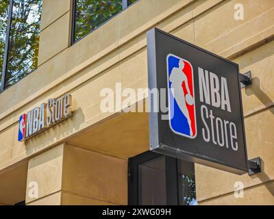 08 19 2024 - Paris, France. NBA store sign with league logo on an old building in Paris city where is located official fans apparel, merchandise shop Stock Photo