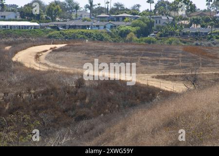 brown hillside with dirt hiking trail Stock Photo