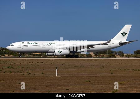 Saudi Arabian Airlines (Wamos Air) Airbus A330-343 (REG: EC-NOG) departing after maintenance in Mata. Stock Photo