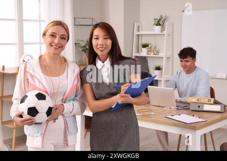Female teachers in school office Stock Photo