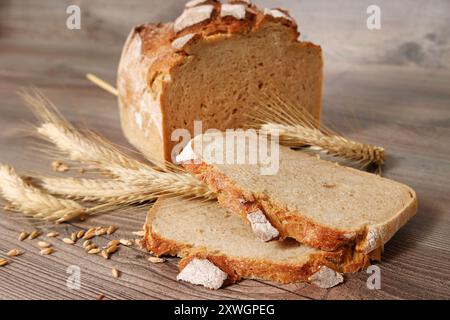 Freshly baked wood stove bread with rye ears Stock Photo