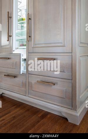 Close up of double refrigerator cabinet with door and drawer open Stock Photo