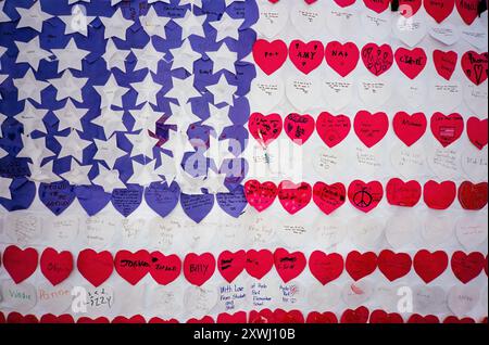 A flag of hearts and stars made by elementary school students with messages of hope and well wishes. On September 11, 2001, four commercial US airplanes were hijacked by Al-Qaeda, an Islamist extremist terrorist group, and were weaponized against the United States. Killing nearly 3000 people and injuring 6000 more it was the worst attack to happen on United States soil. Two of the planes were flown into new York's World Trade Center, destroying the Twin Towers and killing 2,977 people. These are photos from that day and the week to follow and shot on film (Photo by Syndi Pilar/SOPA Images/Si Stock Photo