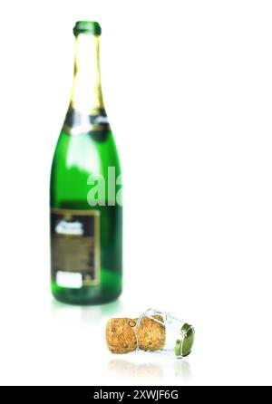 empty champagne bottle with its cork, isolated on white background Stock Photo