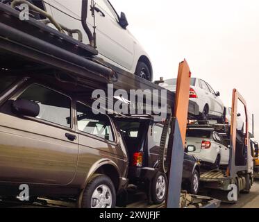 2017: Russian automobles Lada are loaded into the car transportation trailer Stock Photo