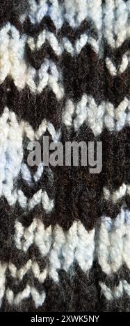 Pattern fabric made of wool. Handmade knitted fabric and black brown wool background texture Stock Photo