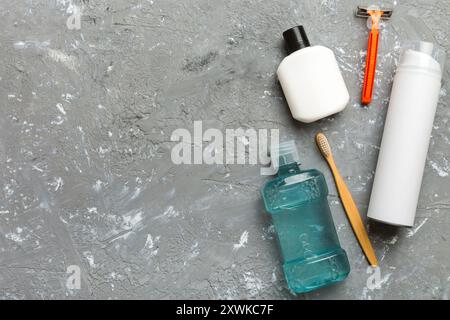 Composition with bath cosmetics on table. razor, toothpaste, soap, gel, toothbrush, mouthwash and other various accessories. Cosmetics for skin health Stock Photo