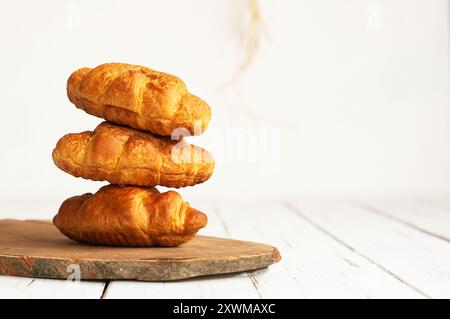 Close up Fresh baked croissants on cutting board Stock Photo