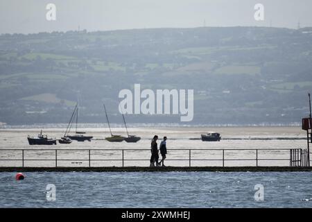 View of the North Wales coast from West Kirby, with sail boast on the River Dee Estuary Stock Photo