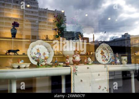 A beautifully laid table with decorations for Easter holiday in a home design store. Minsk, Belarus - April 12, 2024 Stock Photo