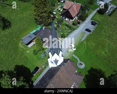 An aerial view of Kuratienkirche Meschach surrounded by lush greenery. Gotzis, Austria Stock Photo