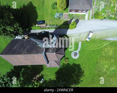 An aerial view of Kuratienkirche Meschach surrounded by lush greenery. Gotzis, Austria Stock Photo