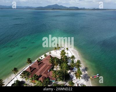 sea with a small bungalow in the middle Stock Photo - Alamy