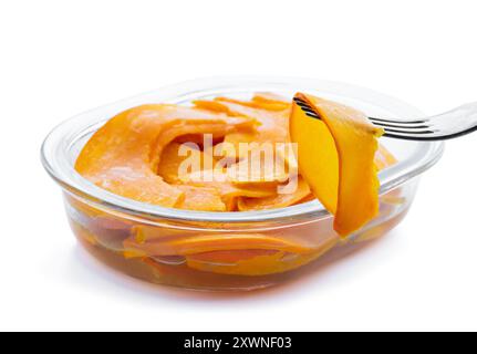 Marinated  pumpkin slices in a glass bowl isolated on white Stock Photo