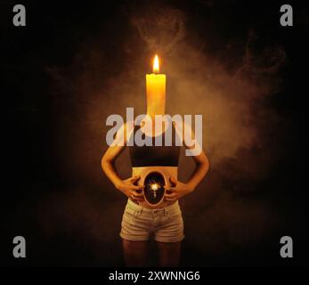 Conceptual woman with a lit candle instead of a head and an illuminated lightbulb shattering in her stomach Stock Photo