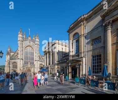 View down Abbey Churchyard towards Bath Abbey with the Roman Baths to the right, Bath, Somerset, England, UK Stock Photo