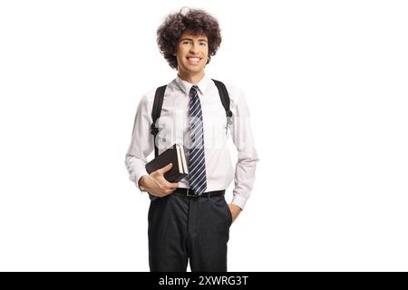Cute young schoolboy with books and backpack pointing up isolated on ...