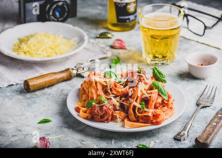 Pasta with mini meatballs, tomato sauce and parmesan cheese Stock Photo