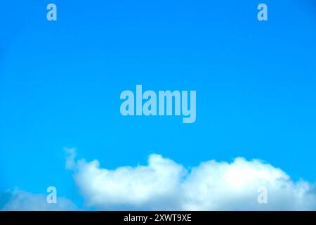 blue sky and white fluffy cumulus clouds Stock Photo