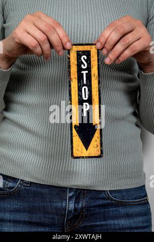 STOP. Pointing arrow with text. Women's health and wellness concept. Stock Photo