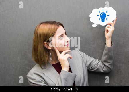 businesswoman holding speech bubble. light bulb and creativity idea Stock Photo