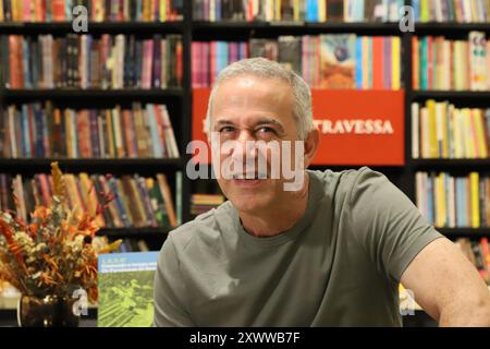 Rio De Janeiro, Brazil. 20th Aug, 2024. João Alberto Barone Reis e Silva, Drummer, Writer and Documentarist, member of the group Os Paralamas do Sucesso, during the launch of his book 1, 2, 3, 4! - Counting time with the Paralamas do Sucesso, at the Travessa bookstore, in the Leblon Shopping Mall, south side of Rio de Janeiro, this Tuesday, 08/20/2024 Credit: Brazil Photo Press/Alamy Live News Stock Photo