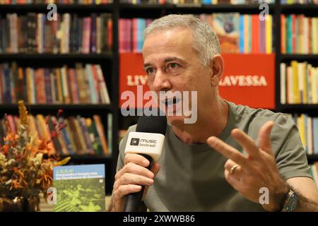 Rio De Janeiro, Brazil. 20th Aug, 2024. João Alberto Barone Reis e Silva, Drummer, Writer and Documentarist, member of the group Os Paralamas do Sucesso, during the launch of his book 1, 2, 3, 4! - Counting time with the Paralamas do Sucesso, at the Travessa bookstore, in the Leblon Shopping Mall, south side of Rio de Janeiro, this Tuesday, 08/20/2024 Credit: Brazil Photo Press/Alamy Live News Stock Photo