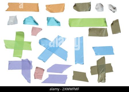 A collection of tape strips in various colors and shapes. The tape strips are scattered across the image, with some overlapping and others standing al Stock Photo