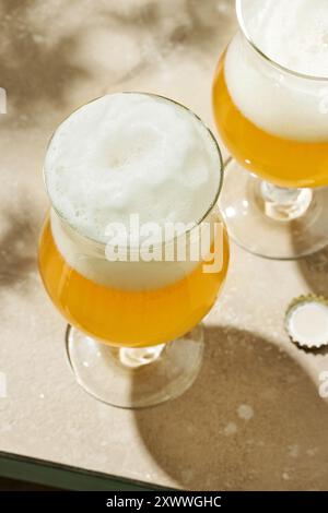 two glasses of beer on shiny table, top view Stock Photo