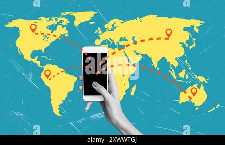 A hand holds a smartphone displaying a dark screen while connecting various locations on a bright yellow world map. Dotted lines illustrate communicat Stock Photo