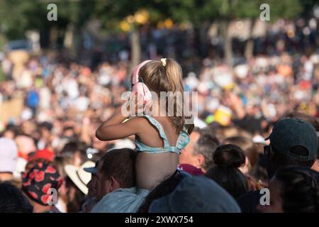 Aluna Festival in the Ardeche department (south-eastern France): young child wearing earmuffs at a festival Stock Photo