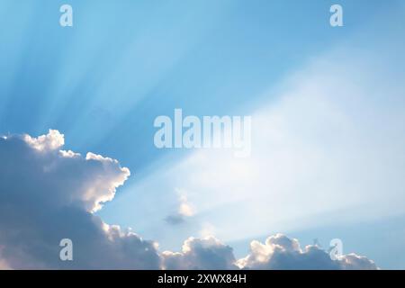 Incredible Sunray Shining Through the Clouds Across the Sky Stock Photo
