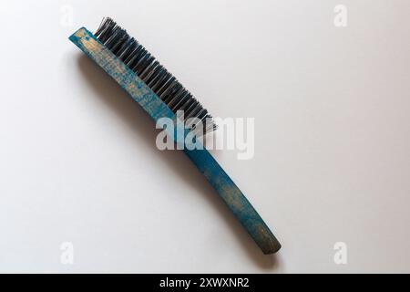wire brush used for a wide range of tasks, including cleaning, surface preparation, and restoration isolated on white background Stock Photo