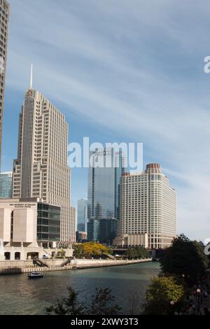 The NBC tower, tourboats on Chicago river and the skyline with modern architecture buildings in downtown Chicago, IL, USA. Stock Photo