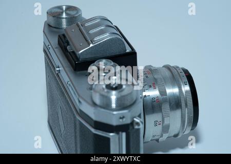 old analog slr camera seen from the side - on white background Stock Photo