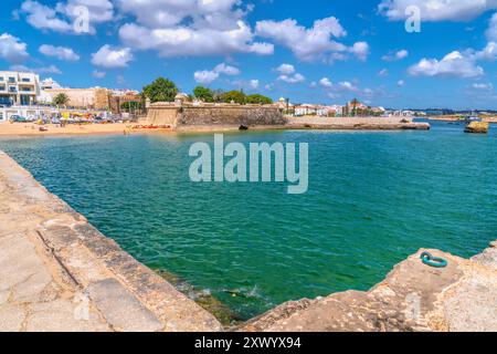 Lagos Portugal historic Algarve town Forte da Ponta da Bandeira on the seafront with blue sea and sky Stock Photo