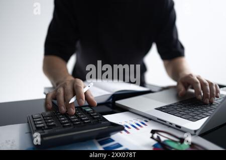 Businessman Analyzing Financial Data and Reports Stock Photo