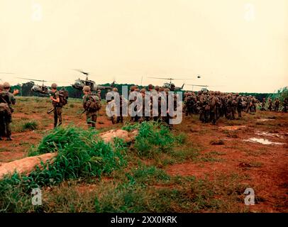 Vietnam War. Soldiers of the 4th Battalion, 50rd Infantry, 173rd Airborne Brigade prepare to be UH1D helicopter air lifted back to the brigade’s base camp.  The battalion just completed a search and destroy mission that was a part of Operation “Toledo”. South Vietnam. September 1, 1966, Stock Photo