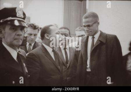 Malcolm X and Martin Luther King at the U.S. Capitol at the time of a press conference about the Senate debate on the Civil Rights Act of 1964. USA, 26 March 1964 By Marion S. Trikosko Stock Photo